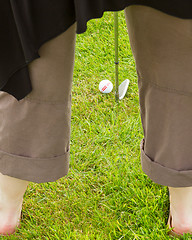 Image showing Golf player hitting the ball