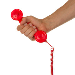 Image showing Man holding a red telephone