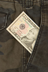 Image showing Macro shot of trendy jeans with american 10 dollar bill