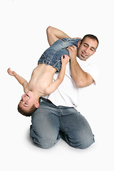 Image showing Father playing with young boy