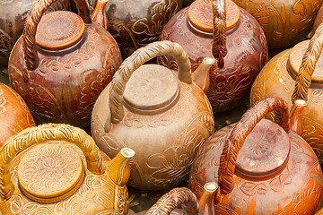 Image showing Many teapots waiting to be sold at a factory