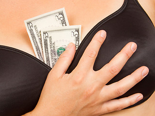 Image showing Concept - woman with cash in a bra