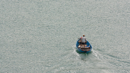 Image showing Vietnamese fisherman in his boat