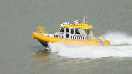 Image showing Yellow Crewtender at high speed