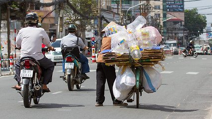 Image showing HUE, VIETNAM - JULY 25, 2012. Vietnamese woman packed her posses