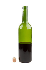 Image showing Half empty red wine bottle 