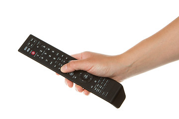 Image showing Woman holding a black remote in her hand