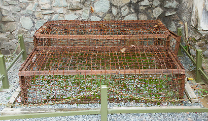 Image showing Two Tiger Cages used in the Vietnam war on display in a museam i