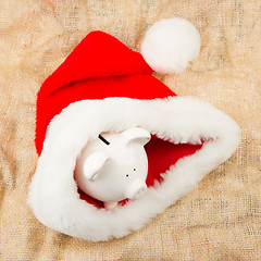 Image showing Piggybank guarding Santa's crisis budget