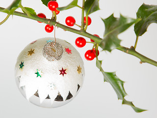 Image showing Very old silver christmas ball hanging from a twig (butchers bro