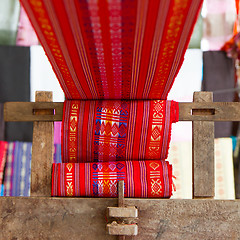 Image showing Handmade silk textile industry, silk scarf on a old machine