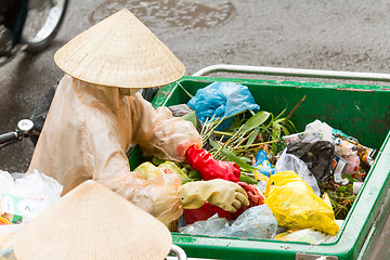 Image showing DA LAT, VIETNAM - 28 JULY 2012: Government worker separates the 