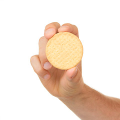 Image showing Man with a biscuit in his hand