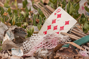 Image showing Old playing card on a pile of garbage