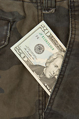 Image showing Macro shot of trendy jeans with american 20 dollar bill