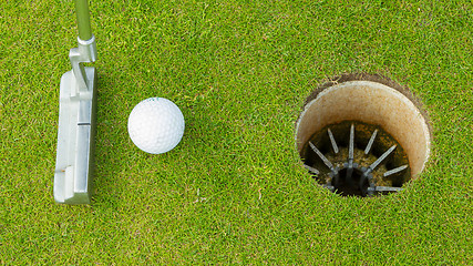 Image showing Golf ball and tee on green cours