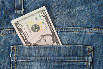 Image showing Macro shot of trendy jeans with american 5 dollar bill