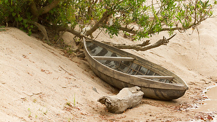 Image showing Small rowing boat on the shore of a small river