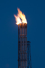 Image showing Burning oil gas flare during the night 