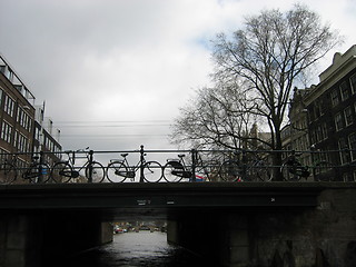 Image showing Bikes on bridge in Amsterdam
