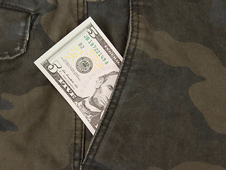 Image showing Macro shot of trendy jeans with american 5 dollar bill