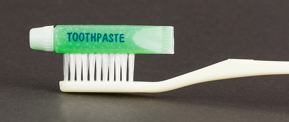 Image showing Toothbrush and green toothpaste isolated