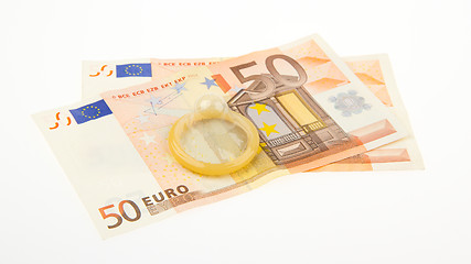 Image showing Condom on two 50 euro bills