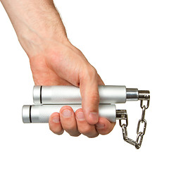 Image showing Hand holding a metal nunchaku