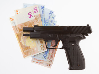 Image showing Semi-automatic gun and money isolated