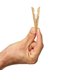 Image showing Hand holding clothes peg