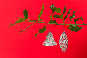 Image showing Old silver bells hanging in Butcher's broom