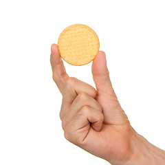 Image showing Man with a biscuit in his hand