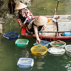Image showing HA LONG BAY, VIETNAM AUG 10, 2012 - Food seller in boat. Many Vi