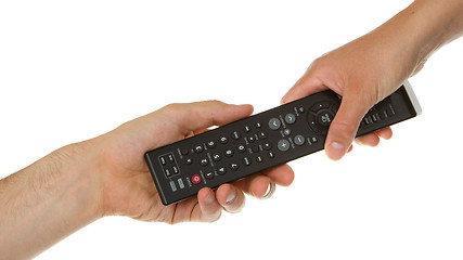 Image showing Man giving woman a black remote