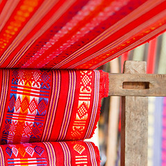 Image showing Handmade silk textile industry, silk scarf on a old machine