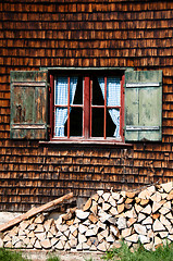 Image showing Ancient window on log house wooden wall