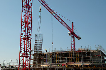 Image showing Construction site with cranes and building