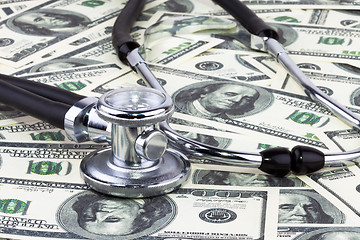 Image showing Stethoscope and dollars