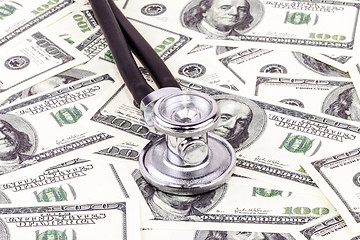 Image showing Stethoscope and dollars