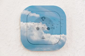 Image showing Conceptual: Birds in the Sky over Power Outlet