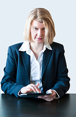 Image showing Business woman with digital tablet PC and headset