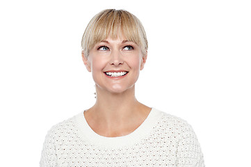 Image showing Snap shot of a smiling blonde looking upwards