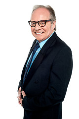 Image showing Bespectacled businessman posing sideways