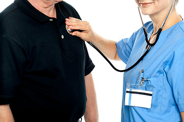 Image showing Cropped image of doctor examining a patient