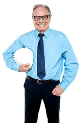 Image showing Portrait of an architect holding a safety helmet