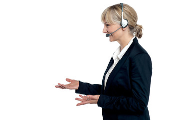 Image showing Female customer care agent in a conversation