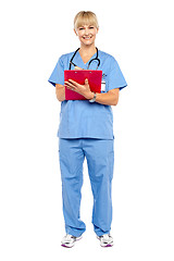 Image showing Medical practitioner posing with a clipboard