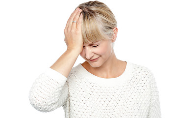 Image showing Sad middle aged woman suffering from headache