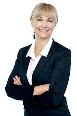 Image showing Smiling corporate head posing with folded arms