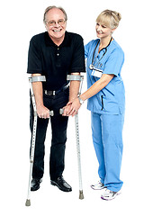 Image showing Experienced physician assisting her patient in recovery process